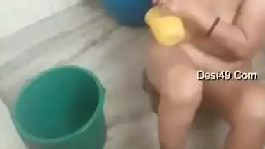 Indian aunty washes body focusing on boobs and muff in the bathroom
