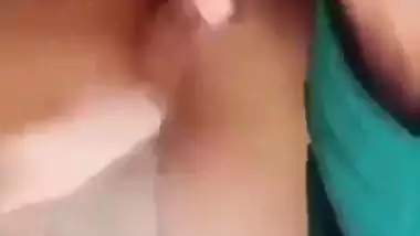 Horny girl squeezes her boobs and fingers her hairy pussy