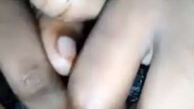 Busty Desi girl fingering her black hairy pussy on XXX camera